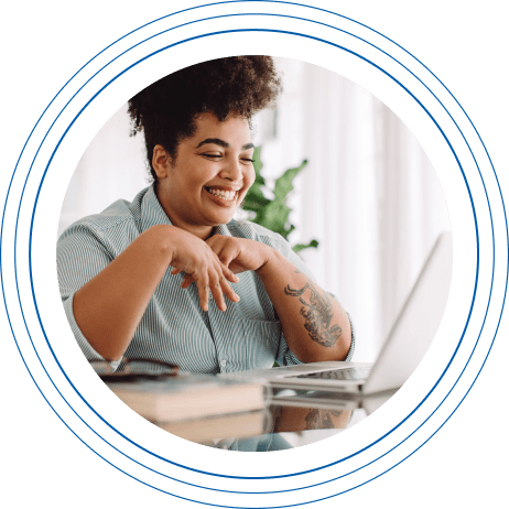 Smiling young woman on a virtual meeting on a laptop computer