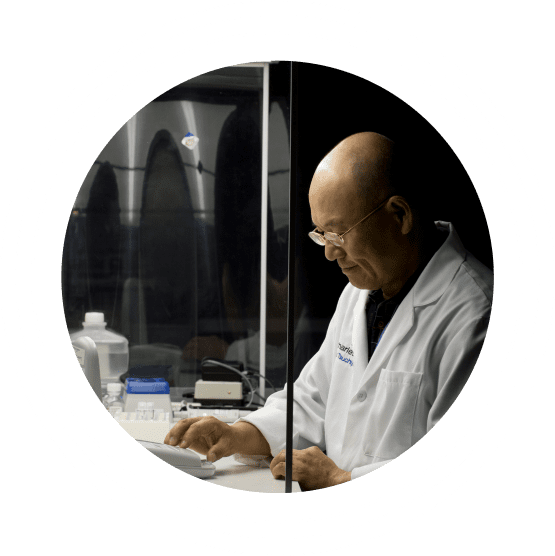 Male Charles River scientific professional in a lab coat working in a laboratory environment