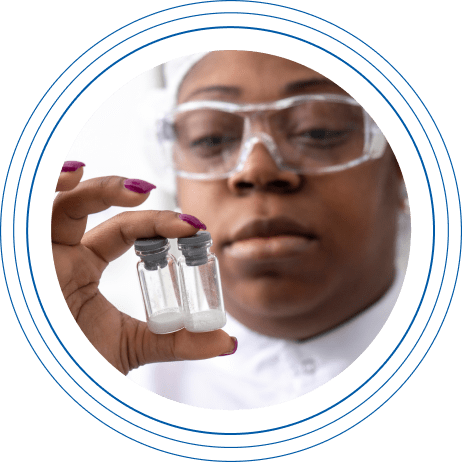 Close-up of female Charles River laboratory professional inspecting glass vials