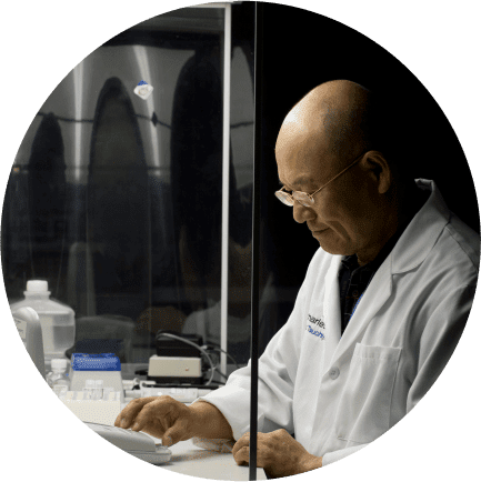 Male Charles River scientific professional in a lab coat working in a laboratory environment