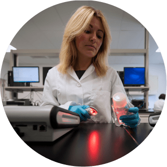 A female laboratory professional working in a state-of-the-art Charles River laboratory.