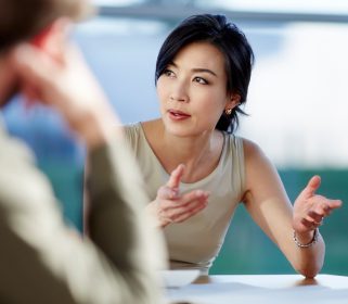 A group of Charles River Labs corporate professionals collaborating around a conference table