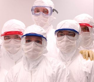A group of Charles River laboratory employees in cleanroom suits