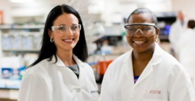 Two smiling laboratory science professional working in a at Charles River Laboratories.
