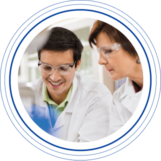 A young male Charles River laboratory professional working with a female senior scientist