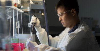 Male Charles River scientist working with a pipette and laboratory samples