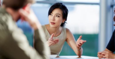 A group of Charles River Labs corporate professionals collaborating around a conference table